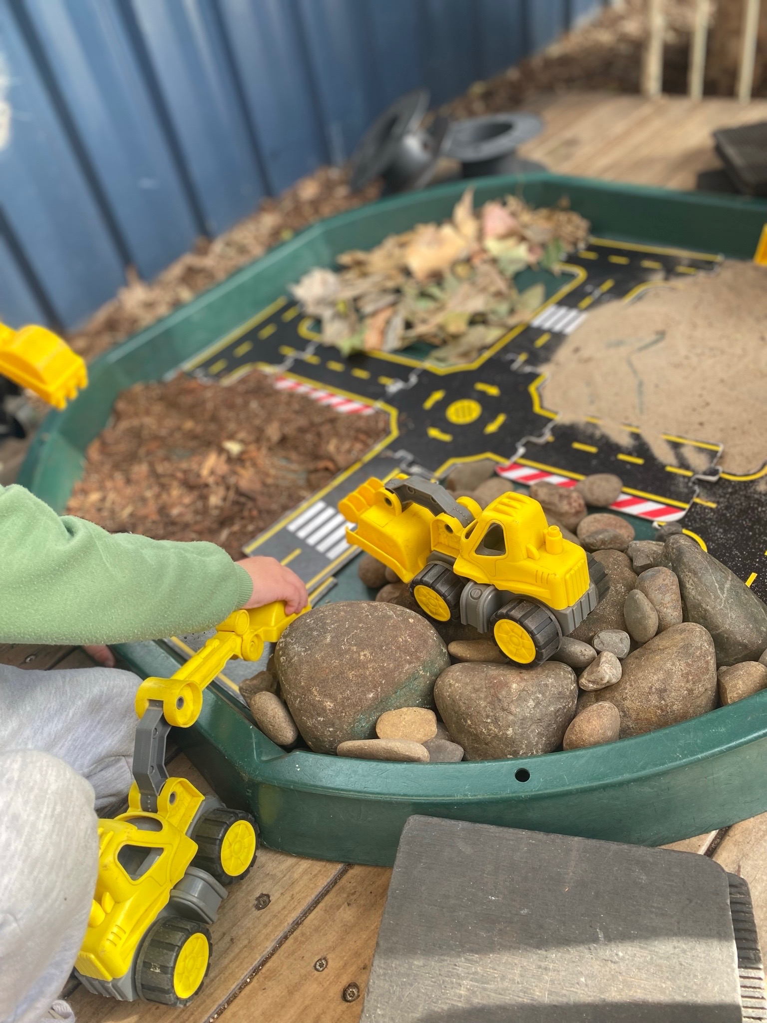 Child learning through imaginative construction play at Lakeview Preschool